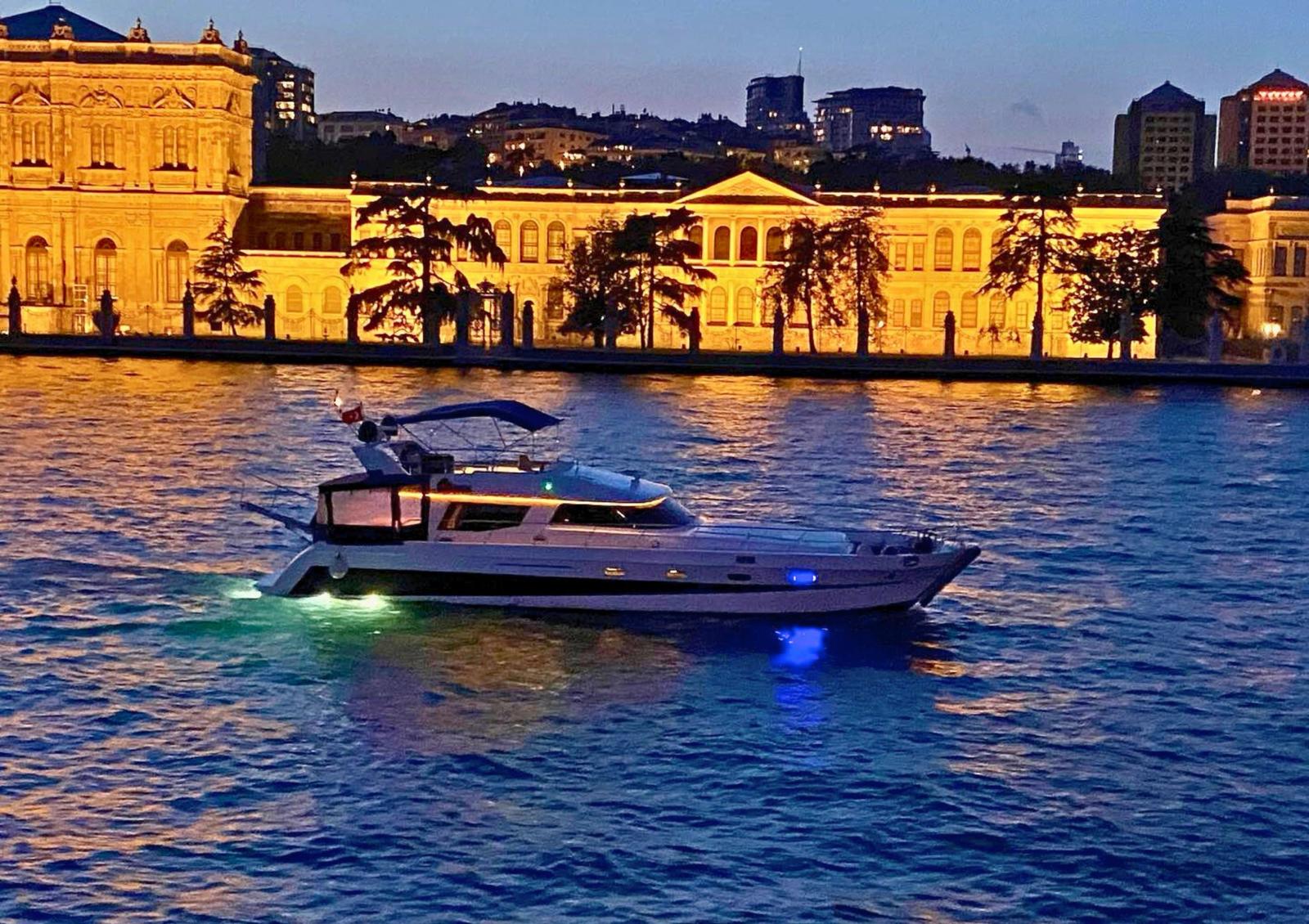 The yacht at night in front of Dolmabahçe Palace